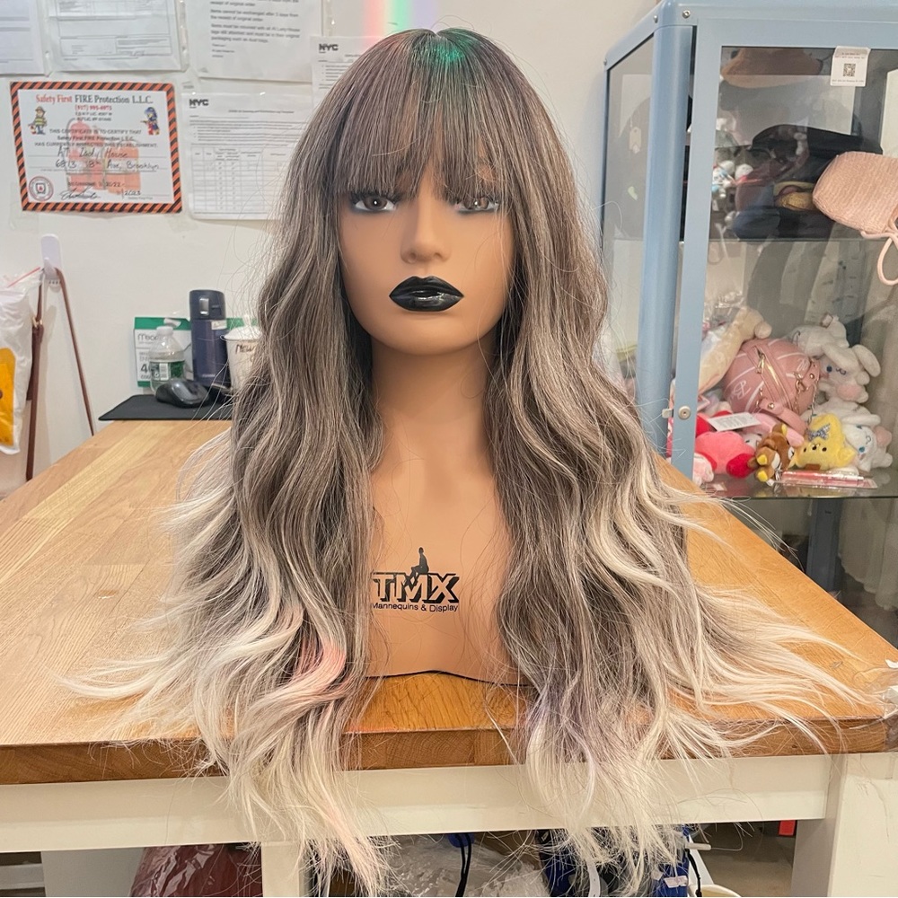 Human hair blend ombre ash brown to blonde layered wig with bang.